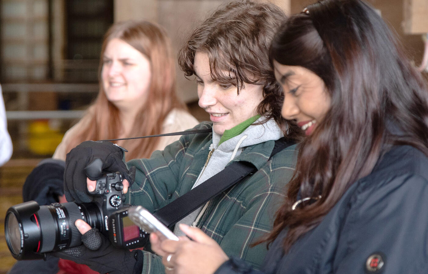 Two students look at a camera. 