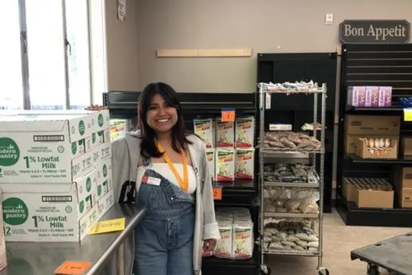 Susie Ortiz in the Basic Needs Center food pantry, after a successful pantry day cleared lots of food off the shelves.
