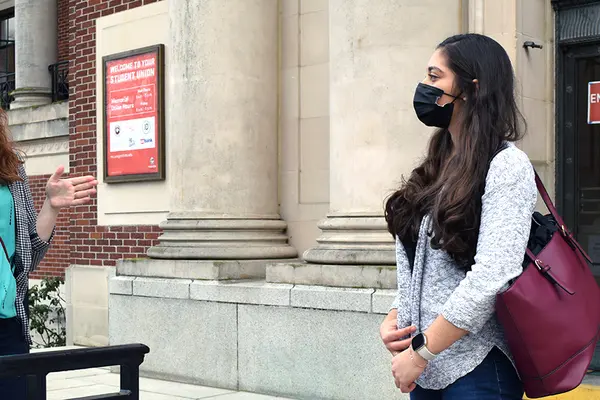 Caitlin McVay speaks with Stephanie Hasan outside of the Memorial Union