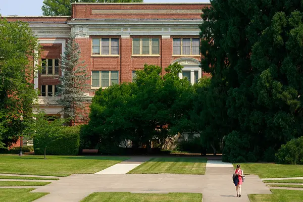person walking in MU quad