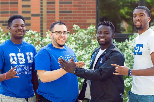 Four students pose outside the Lonnie B. Harris Black Cultural Center